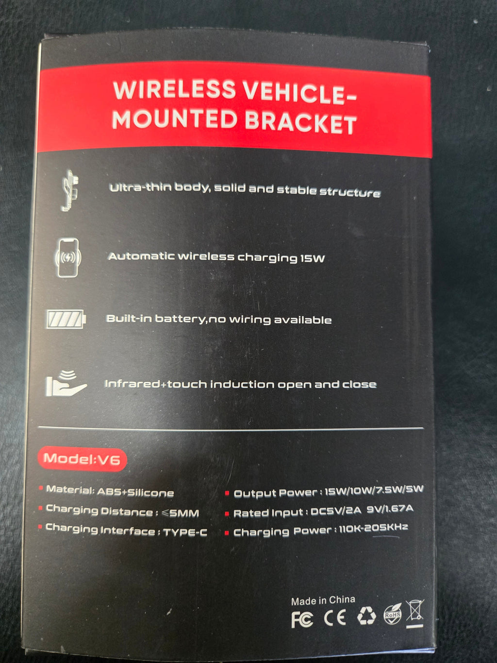 Black and red packaging of a wireless vehicle-mounted bracket with text and icons on a dark background