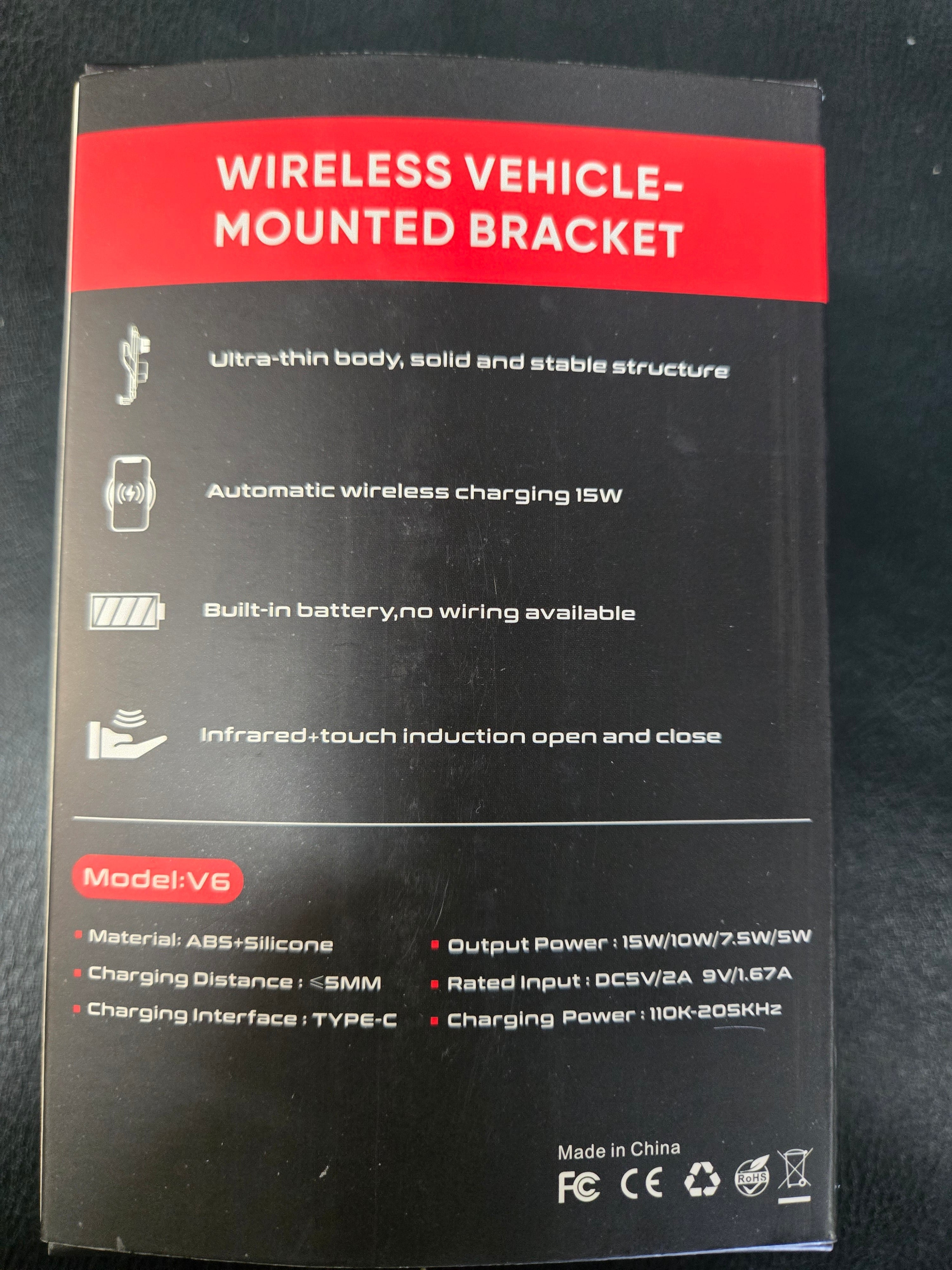 Black and red packaging of a wireless vehicle-mounted bracket with text and icons on a dark background