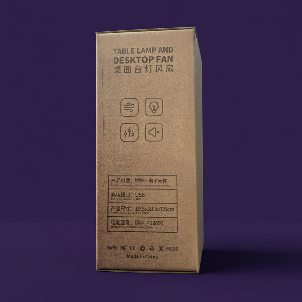 A brown cardboard product box for a table lamp and desktop fan, photographed in a retail or showroom environment with blurred electronics in the background.