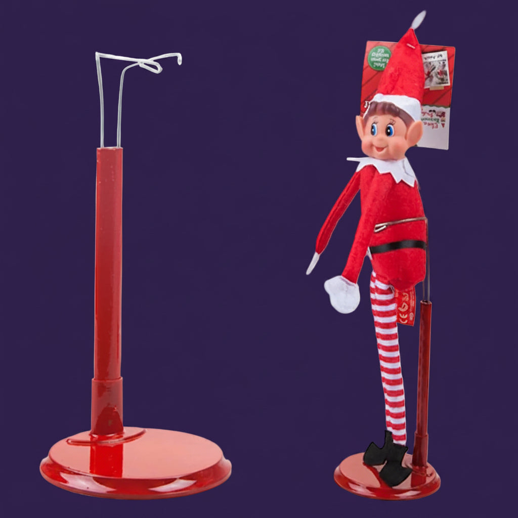 Elves Behaving Badly elf doll positioned on red display stand