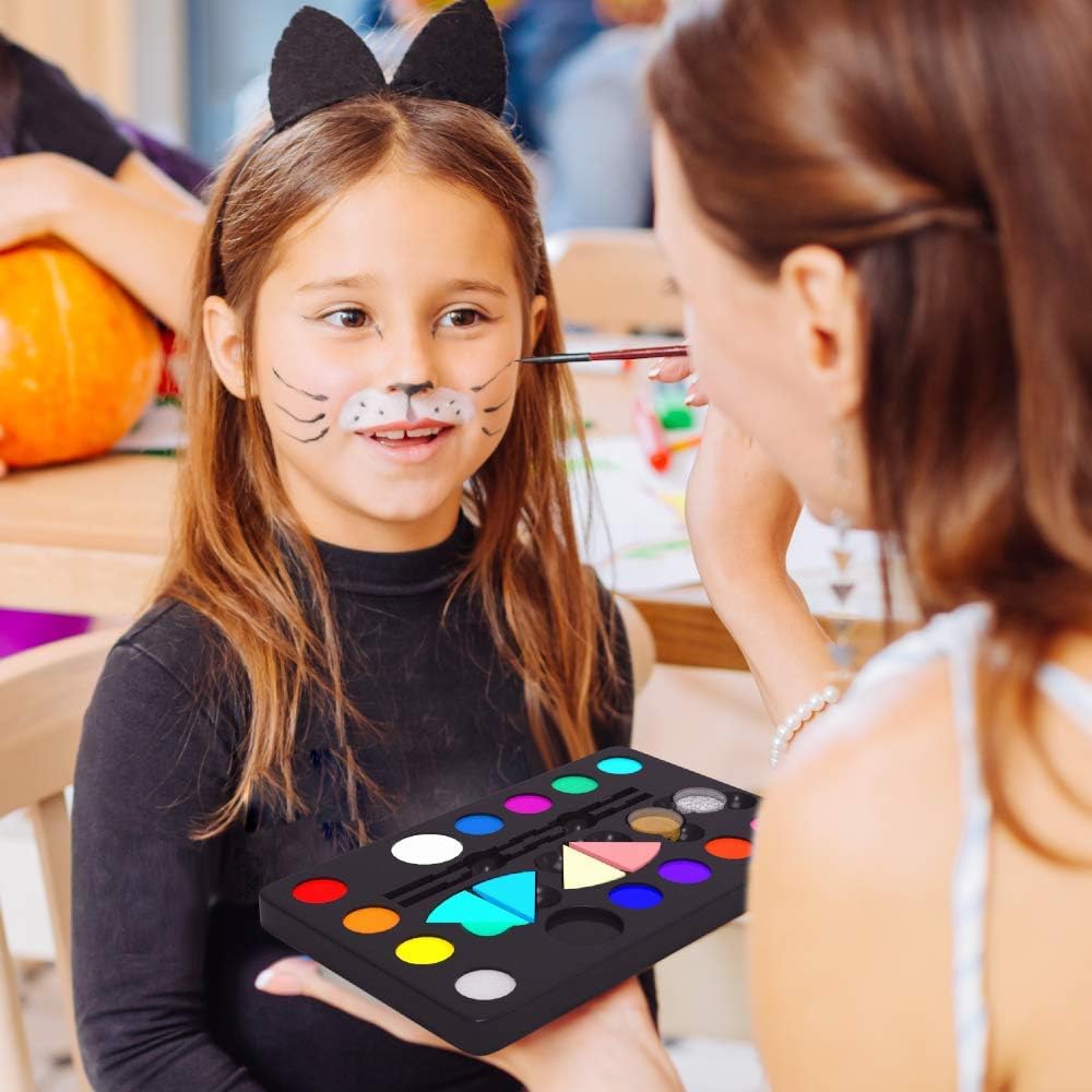 Applying water-based face paint from 16-colour palette at a children's party