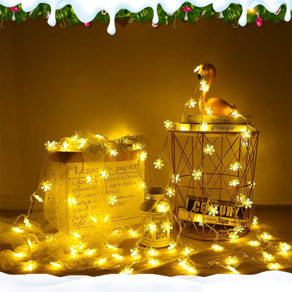 Festive snowflake LED fairy lights styled around modern home side table decor