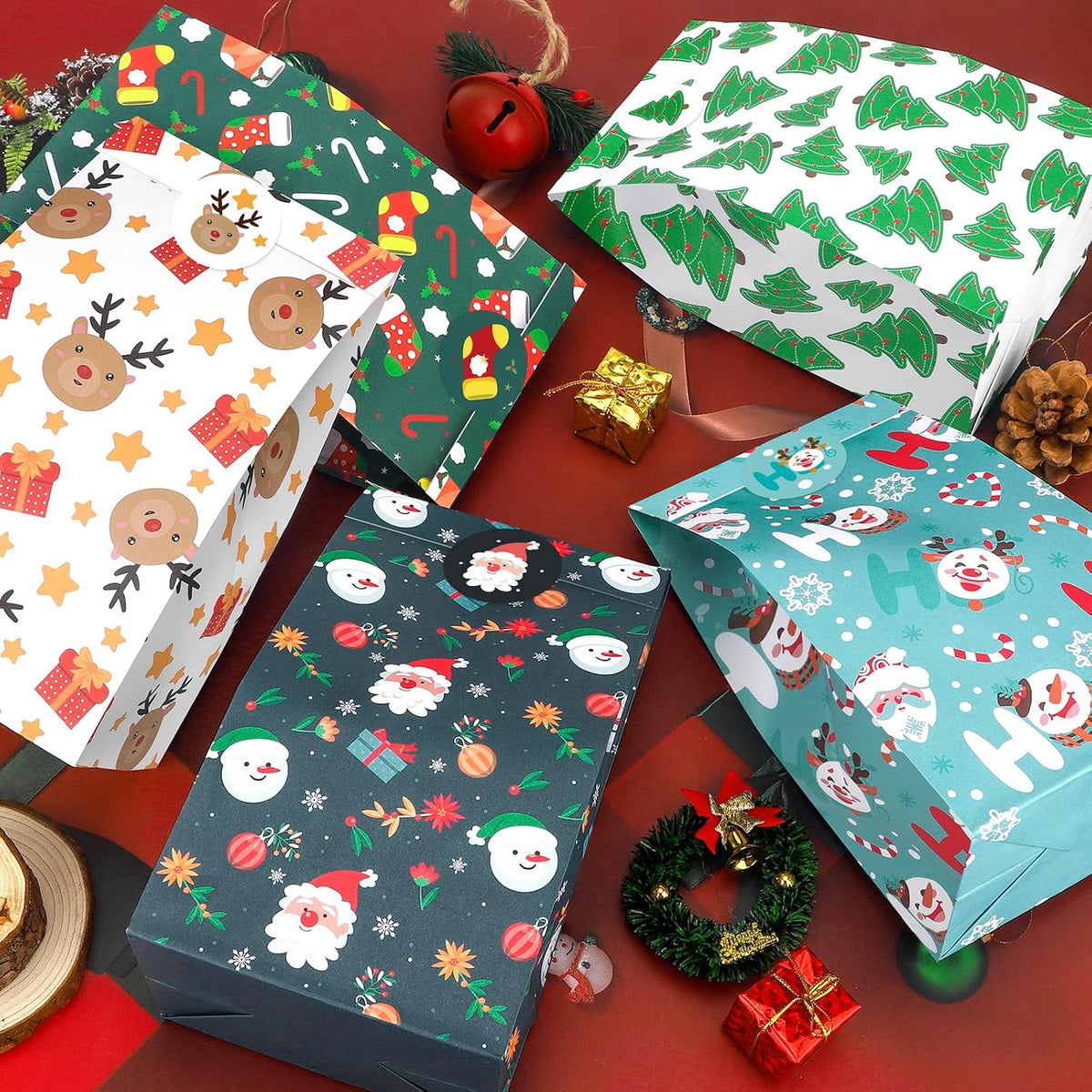 Festive Christmas paper gift bags flat lay with holiday styling accessories