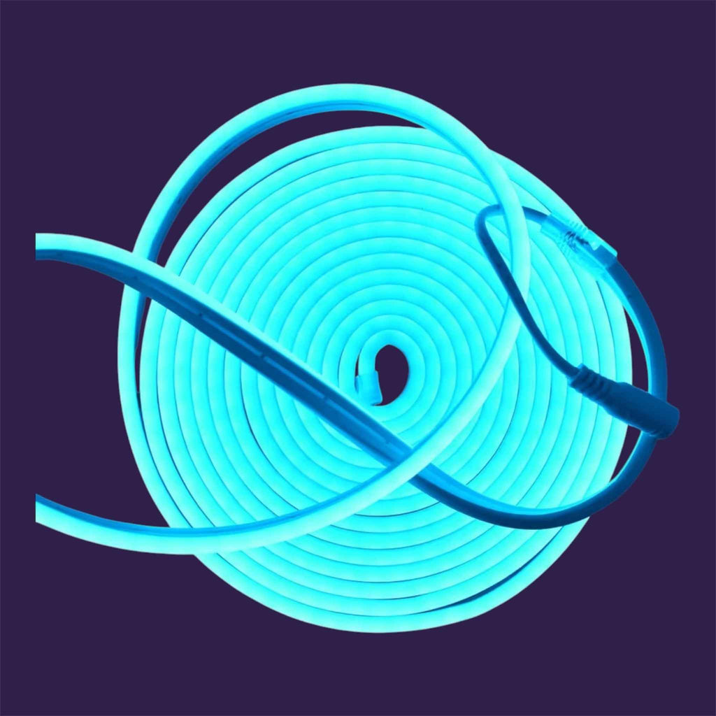 Top-down view of 5m Blue Neon LED Flexible Strip coil with power connector against a dark background