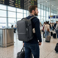 Cabin Bag 45x36x20 Travel Backpack worn by a passenger in an airport terminal