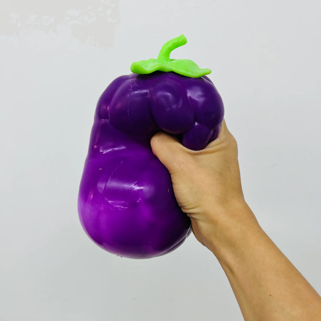 Jumbo Purple Grape Squishy squeezed in hand