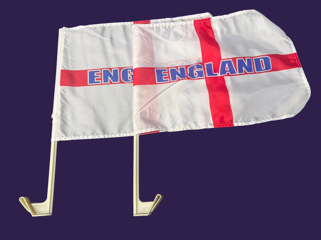 Flag with 'England' text and red cross on a white background, attached to a flagpole against a dark background.