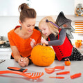 Halloween pumpkin carving kit tools set on kitchen counter