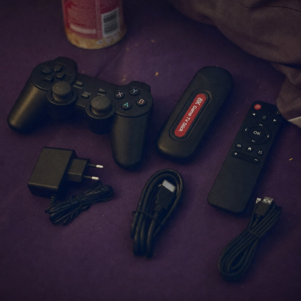 Q9 Pro Game TV Stick 8K gaming kit overhead flat lay including wireless gamepad, receiver, and adapter