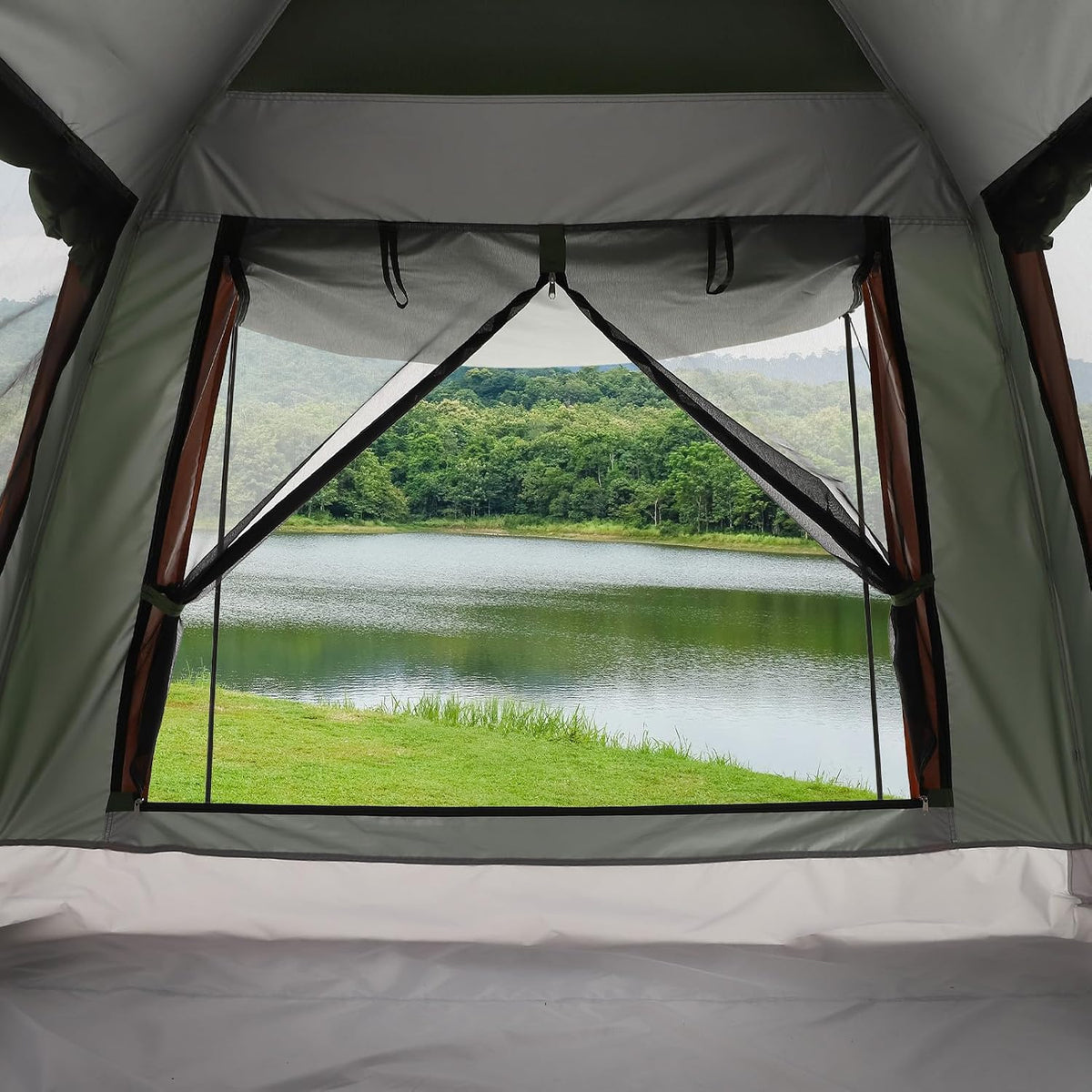 Spacious interior view of waterproof camping tent overlooking scenic landscape
