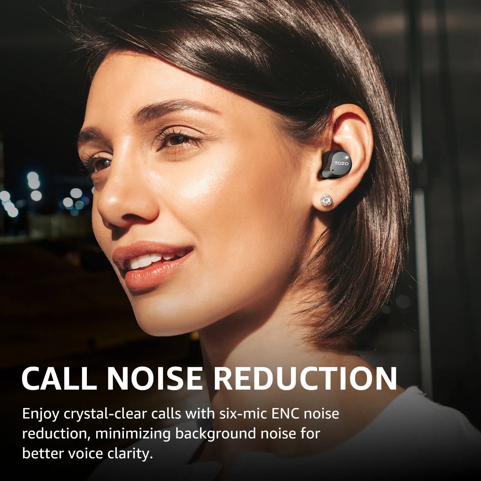 TOZO NC9 Hybrid ANC Earbuds - Close-up profile of a woman wearing the sleek matte black wireless earbud outdoors at night