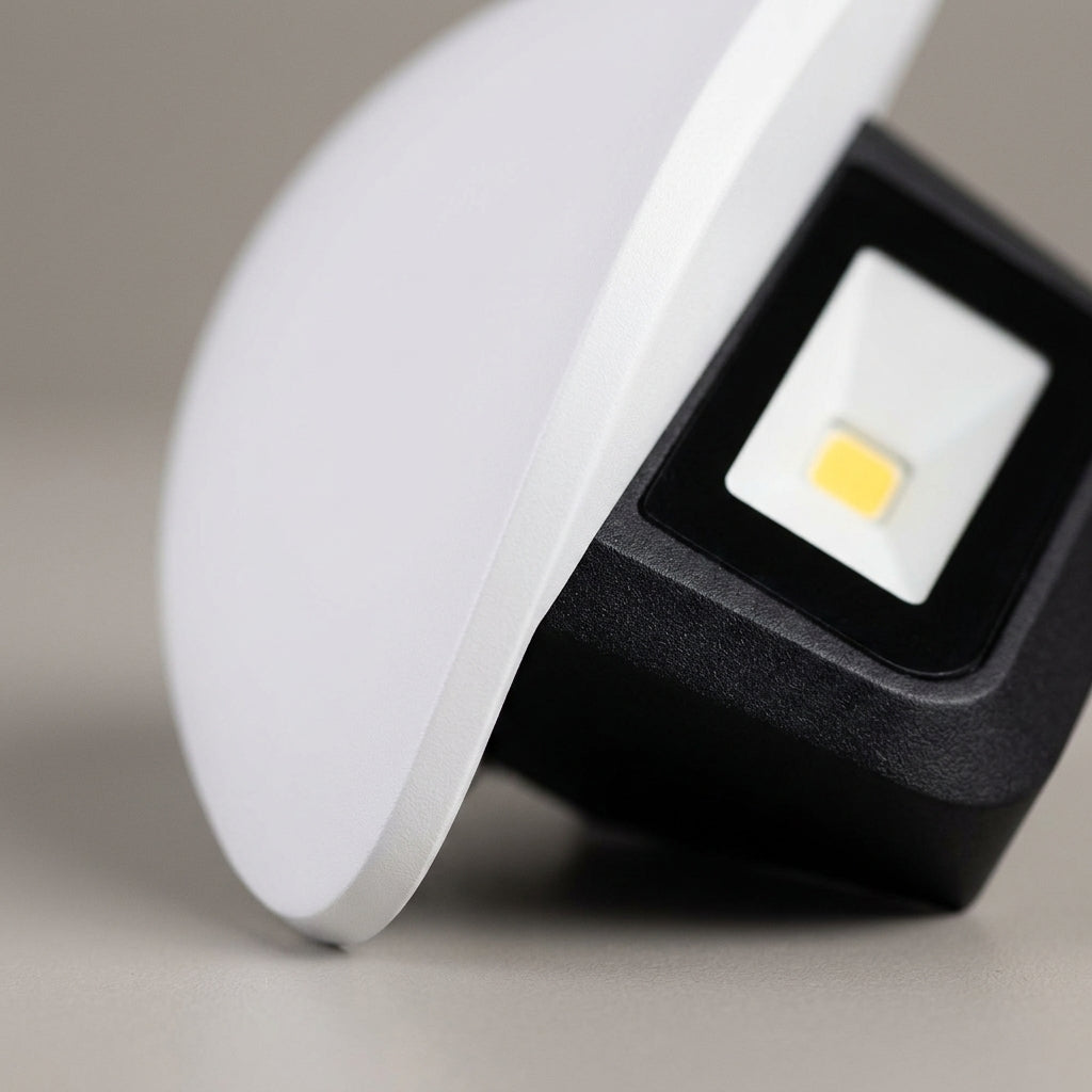 Close-up detail of smooth matte white finish on curved LED light