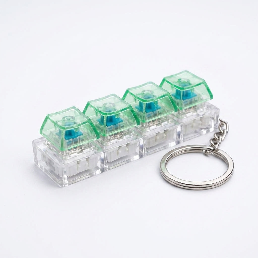 Premium 4-unit mechanical keyboard switch fidget toy keychain on a clean, seamless white studio background