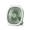 Premium studio product photo of a sage green circular desktop fan with decorative bear ears on white background